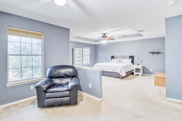 2726 Indigo Stone Ln, Katy, TX 77449 - bedroom featuring a raised ceiling, carpet flooring, and a ceiling fan