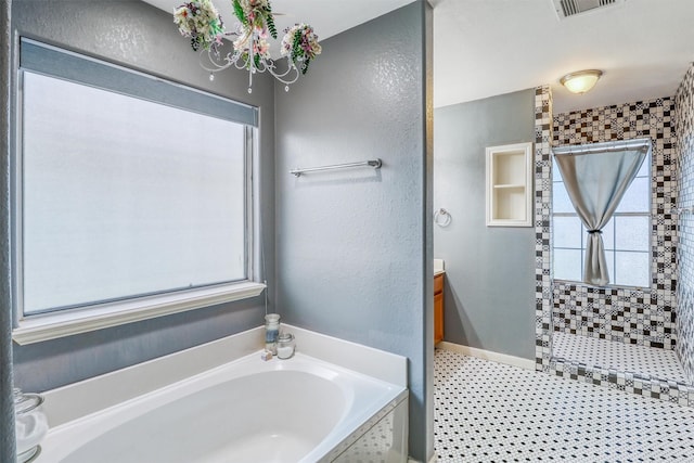 2726 Indigo Stone Ln, Katy, TX 77449 - full bathroom with healthy amount of natural light, a garden tub, tiled shower, and vanity