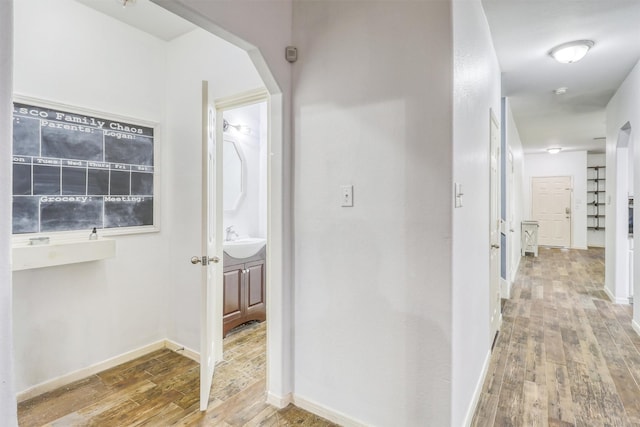 2726 Indigo Stone Ln, Katy, TX 77449 - hall with hardwood / wood-style flooring and a sink