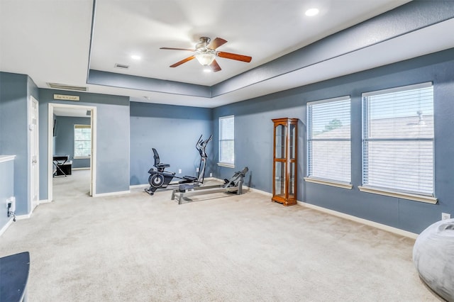 2726 Indigo Stone Ln, Katy, TX 77449 - workout room with ceiling fan, carpet flooring, a raised ceiling, and healthy amount of natural light