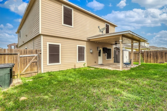 2726 Indigo Stone Ln, Katy, TX 77449 - rear view of property with a patio, a fenced backyard, a ceiling fan, and a gate