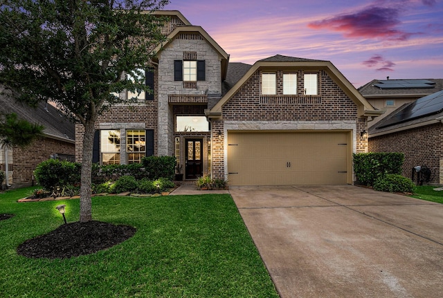 9215 Union Meadow Ln, Cypress, TX 77433 - view of front of house with brick siding, driveway, a yard, and stone siding