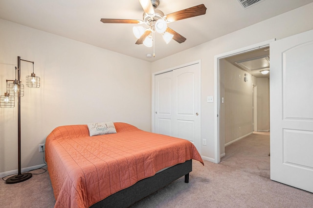 9215 Union Meadow Ln, Cypress, TX 77433 - bedroom featuring attic access, light colored carpet, a closet, and ceiling fan