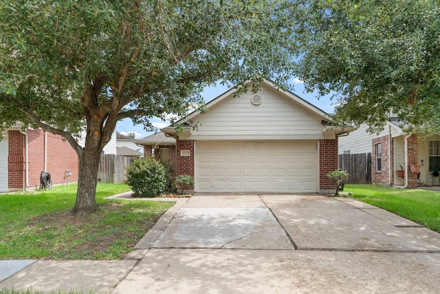14239 Brunswick Point Ln, Houston, TX 77047 - view of front of home featuring driveway, brick siding, and an attached garage
