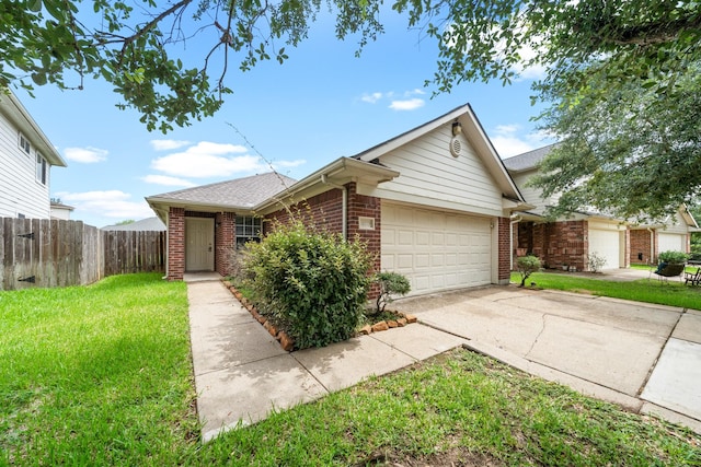 14239 Brunswick Point Ln, Houston, TX 77047 - view of front of property featuring brick siding, an attached garage, concrete driveway, and a shingled roof