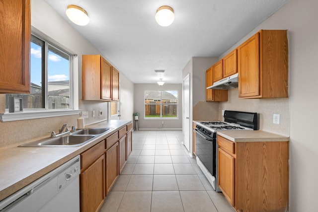 14239 Brunswick Point Ln, Houston, TX 77047 - kitchen with black range with gas cooktop, dishwasher, under cabinet range hood, light countertops, and light tile patterned floors