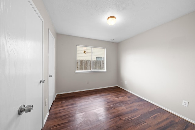 14239 Brunswick Point Ln, Houston, TX 77047 - unfurnished bedroom featuring dark wood-type flooring and baseboards