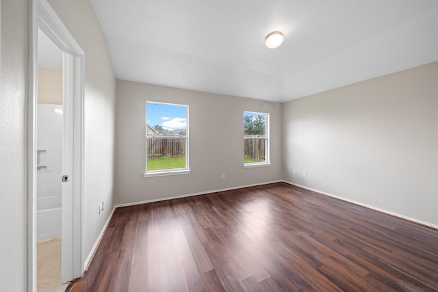 14239 Brunswick Point Ln, Houston, TX 77047 - unfurnished room with dark wood-style floors and baseboards