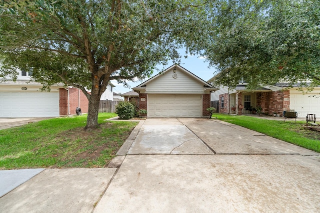 14239 Brunswick Point Ln, Houston, TX 77047 - view of front of property featuring brick siding, a garage, and driveway