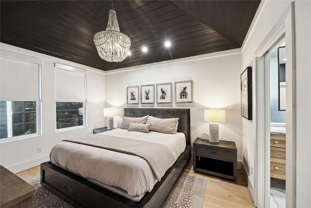406 Bomar St, Houston, TX 77006 - bedroom featuring wood finished floors, a chandelier, and wooden ceiling