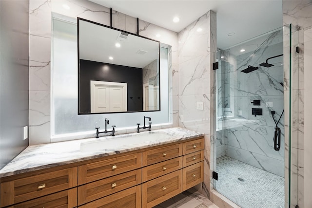 406 Bomar St, Houston, TX 77006 - full bath featuring a marble finish shower, marble finish flooring, vanity, and recessed lighting