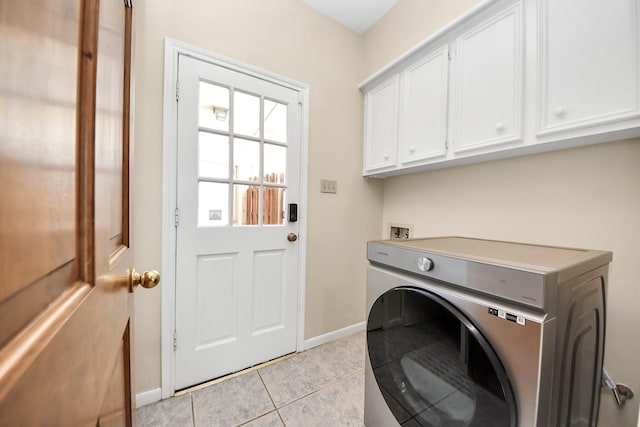 10503 Great Plains Ln, Houston, TX 77064 - laundry room with washer / dryer, cabinet space, and light tile patterned floors