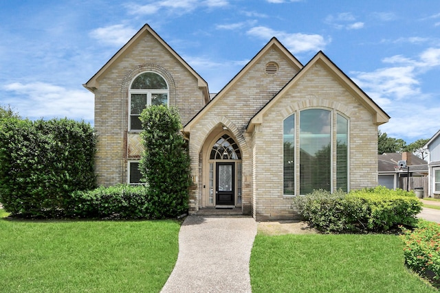 10503 Great Plains Ln, Houston, TX 77064 - view of front of property featuring brick siding and a front yard