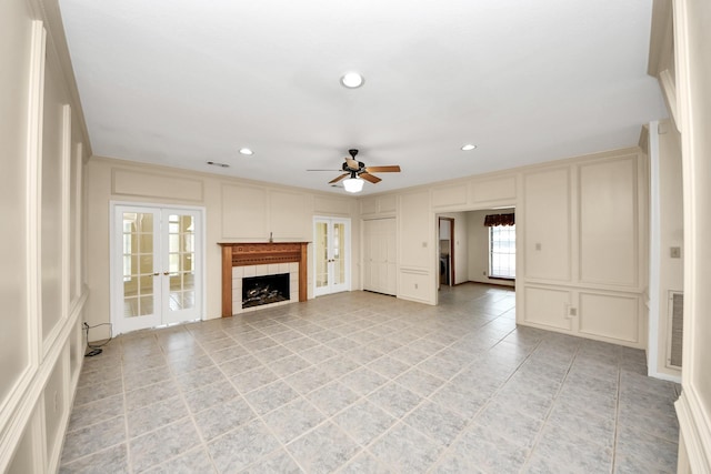 10503 Great Plains Ln, Houston, TX 77064 - unfurnished living room with a decorative wall, ceiling fan, light tile patterned floors, recessed lighting, and a fireplace