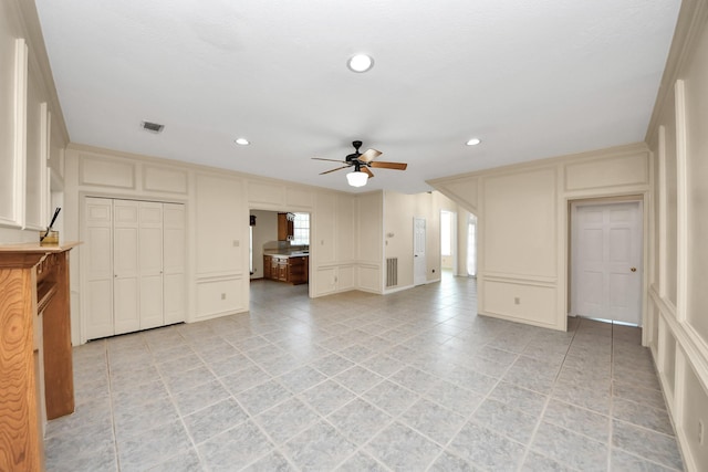 10503 Great Plains Ln, Houston, TX 77064 - unfurnished living room featuring a decorative wall, ceiling fan, recessed lighting, and light tile patterned floors