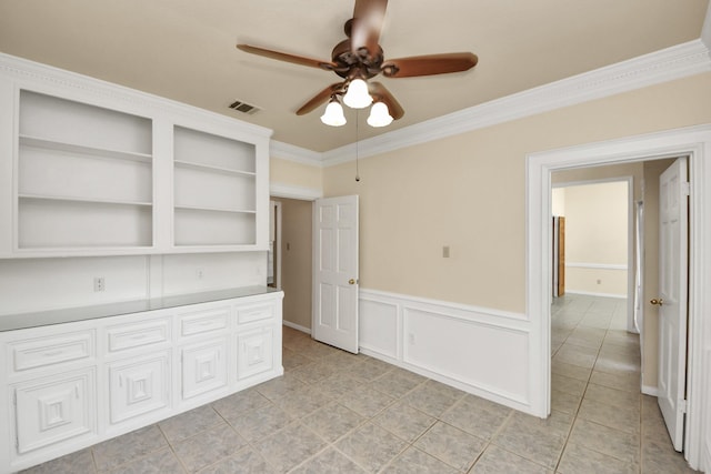 10503 Great Plains Ln, Houston, TX 77064 - spare room featuring ceiling fan, ornamental molding, light tile patterned flooring, and wainscoting