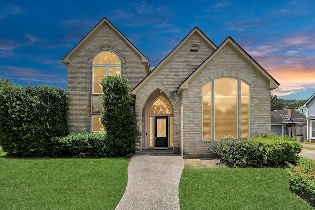 10503 Great Plains Ln, Houston, TX 77064 - view of front of home with brick siding and a lawn