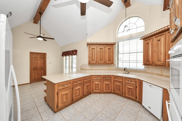 10503 Great Plains Ln, Houston, TX 77064 - kitchen with a ceiling fan, white appliances, high vaulted ceiling, a peninsula, and beamed ceiling