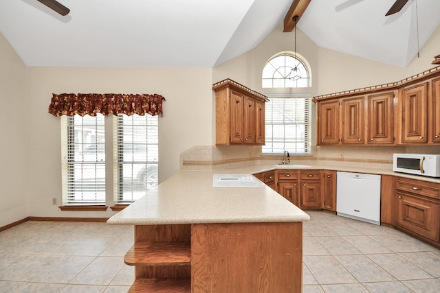 10503 Great Plains Ln, Houston, TX 77064 - kitchen featuring white appliances, ceiling fan, a peninsula, light countertops, and tasteful backsplash