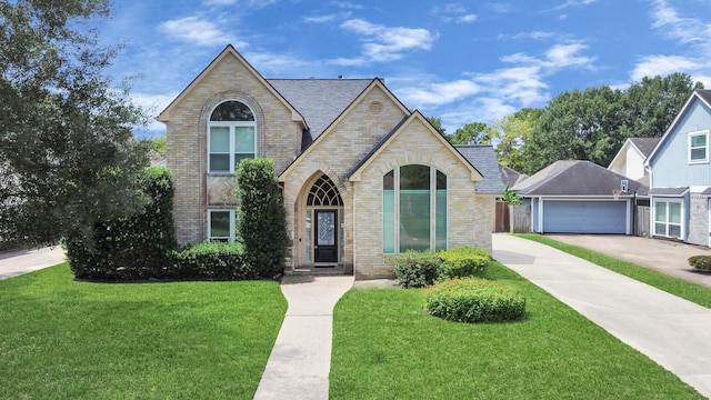 10503 Great Plains Ln, Houston, TX 77064 - view of front of home with brick siding, a front lawn, a garage, and concrete driveway
