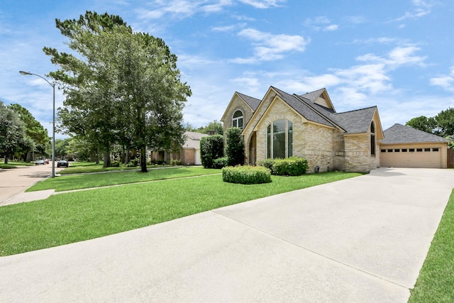 10503 Great Plains Ln, Houston, TX 77064 - view of front of property featuring a front yard, stone siding, concrete driveway, brick siding, and roof with shingles