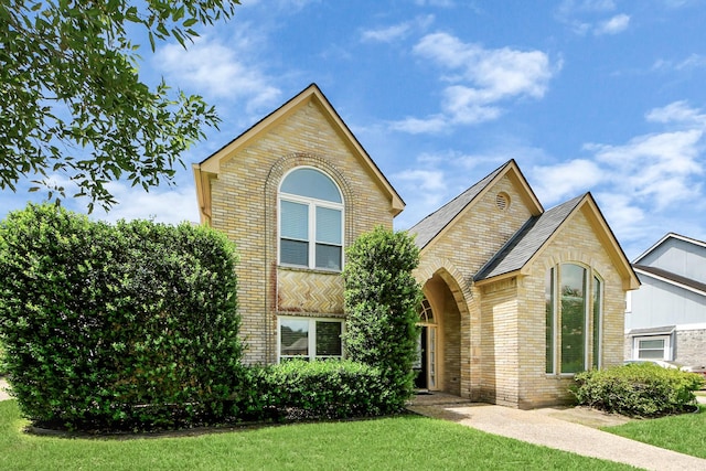 10503 Great Plains Ln, Houston, TX 77064 - view of front facade with brick siding and a front yard