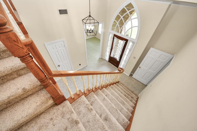 10503 Great Plains Ln, Houston, TX 77064 - tiled foyer entrance with stairs, a high ceiling, and a chandelier