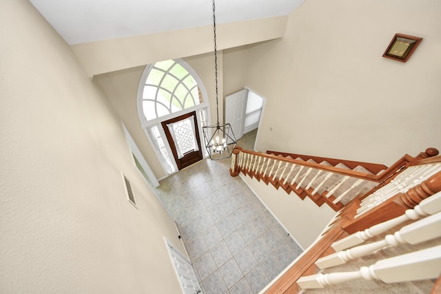 10503 Great Plains Ln, Houston, TX 77064 - foyer featuring a high ceiling, a chandelier, and stairway