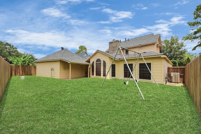 10503 Great Plains Ln, Houston, TX 77064 - back of property featuring a chimney and a fenced backyard