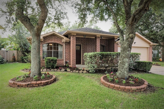 1714 Oak Ridge Dr, Kemah, TX 77565 - ranch-style house with brick siding, an attached garage, and driveway
