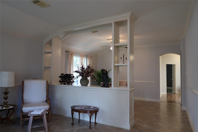 1714 Oak Ridge Dr, Kemah, TX 77565 - living area with arched walkways, a ceiling fan, lofted ceiling, ornamental molding, and tile patterned floors