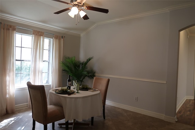 1714 Oak Ridge Dr, Kemah, TX 77565 - dining room with arched walkways, ceiling fan, crown molding, and healthy amount of natural light