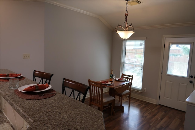 1714 Oak Ridge Dr, Kemah, TX 77565 - dining space with crown molding, dark wood-style floors, and lofted ceiling