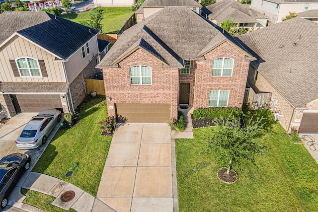 12610 Marley Hills Trl, Houston, TX 77089 - view of front of property with brick siding, an attached garage, a shingled roof, and driveway