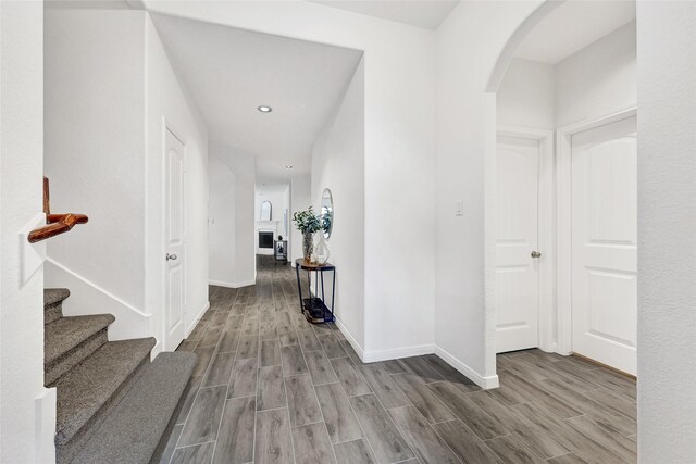 31 Hearthwick Rd, Tomball, TX 77375 - foyer entrance featuring arched walkways, wood finished floors, recessed lighting, and stairway