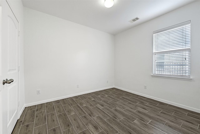 31 Hearthwick Rd, Tomball, TX 77375 - spare room featuring dark wood finished floors and baseboards