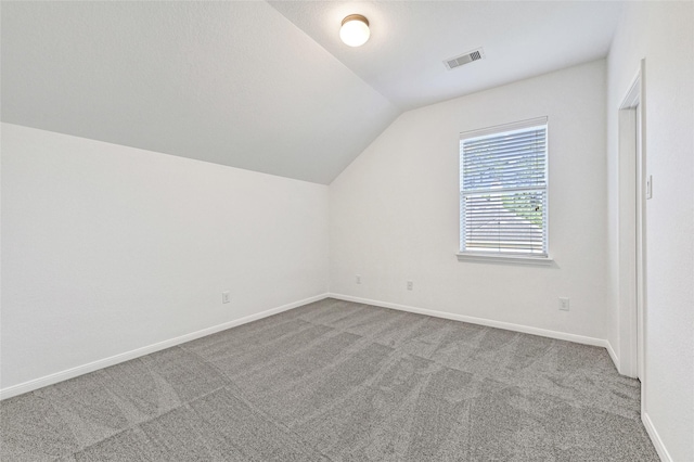 31 Hearthwick Rd, Tomball, TX 77375 - additional living space with vaulted ceiling and carpet