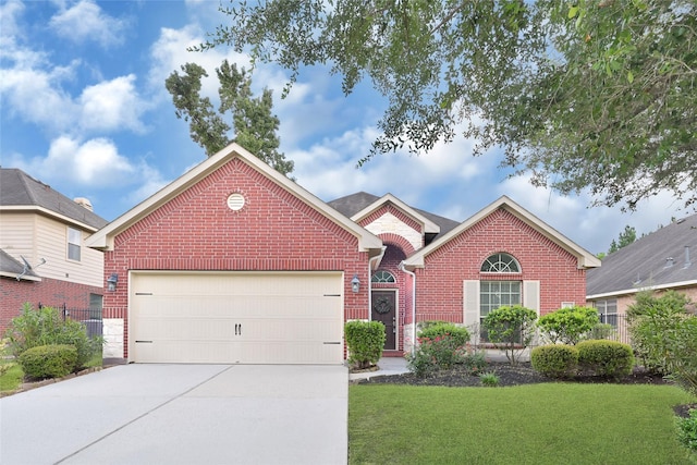 31 Hearthwick Rd, Tomball, TX 77375 - view of front of house featuring brick siding, driveway, a garage, and a front yard