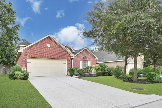 31 Hearthwick Rd, Tomball, TX 77375 - ranch-style home featuring brick siding, an attached garage, and concrete driveway