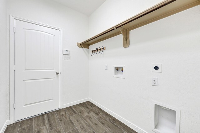 31 Hearthwick Rd, Tomball, TX 77375 - laundry room with electric dryer hookup, dark wood finished floors, and hookup for a washing machine
