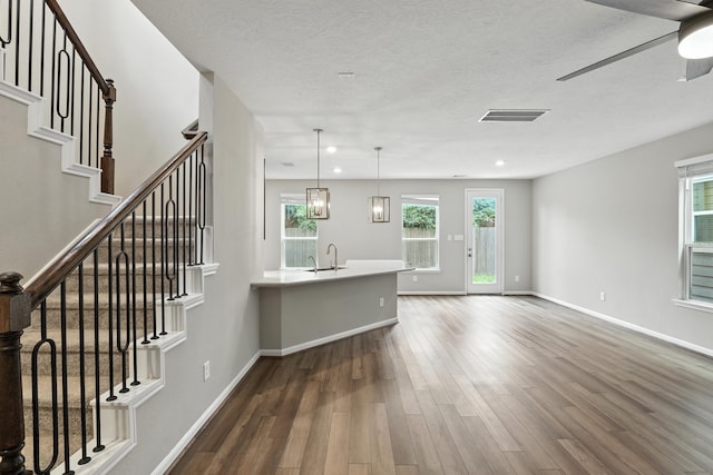 8618 Cedar Plains Ln, Houston, TX 77080 - living room featuring dark wood-style floors, a ceiling fan, stairway, recessed lighting, and a textured ceiling