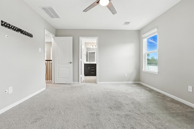 8618 Cedar Plains Ln, Houston, TX 77080 - unfurnished bedroom with light colored carpet, ceiling fan, and ensuite bathroom