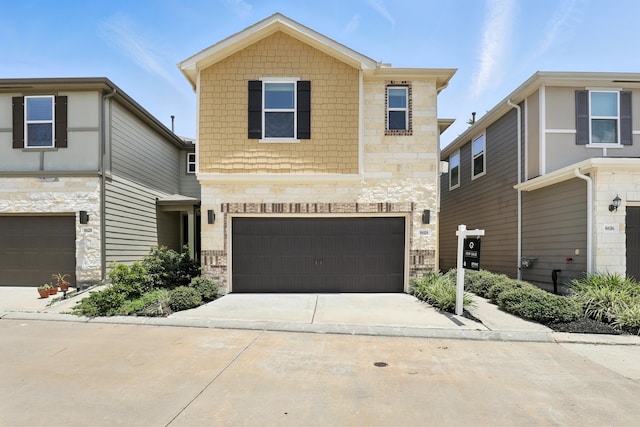 8618 Cedar Plains Ln, Houston, TX 77080 - view of front of house with an attached garage, stone siding, and concrete driveway