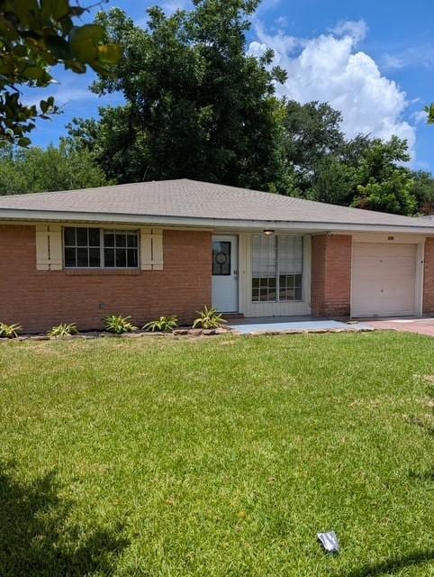 229 S Fulton St S, Texas City, TX 77591 - ranch-style home with a garage, brick siding, and a front yard