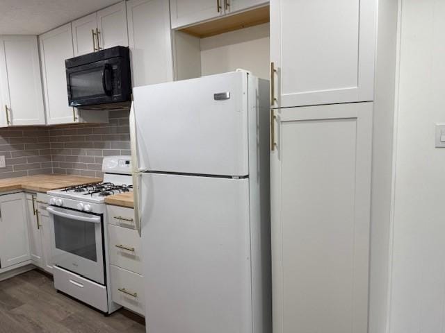 229 S Fulton St S, Texas City, TX 77591 - kitchen with white appliances, white cabinets, wood finished floors, and backsplash