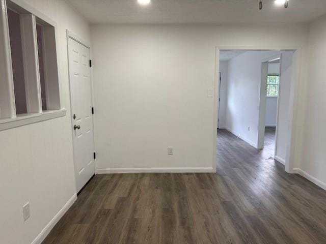 229 S Fulton St S, Texas City, TX 77591 - spare room featuring dark wood finished floors and baseboards
