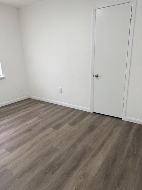 229 S Fulton St S, Texas City, TX 77591 - empty room featuring dark wood-style floors and baseboards