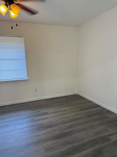 229 S Fulton St S, Texas City, TX 77591 - empty room with a ceiling fan and dark wood-style flooring