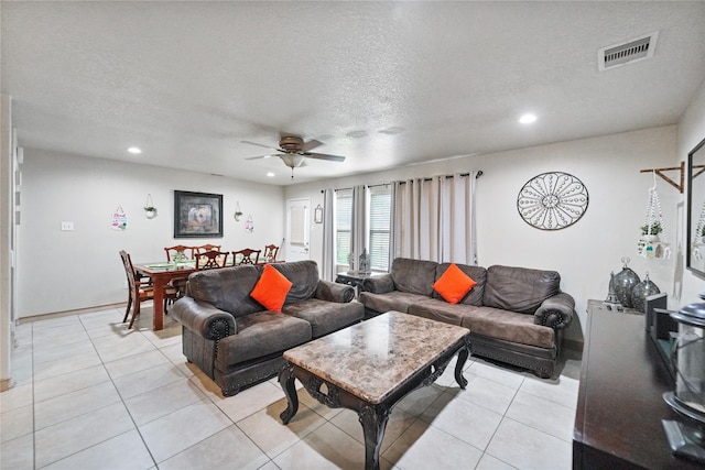 8011 Sumal Cir, Baytown, TX 77521 - living room with a ceiling fan, recessed lighting, a textured ceiling, and light tile patterned floors