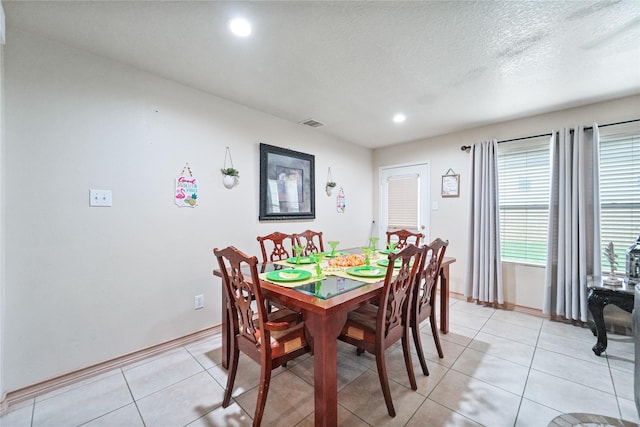 8011 Sumal Cir, Baytown, TX 77521 - dining area with light tile patterned floors and recessed lighting